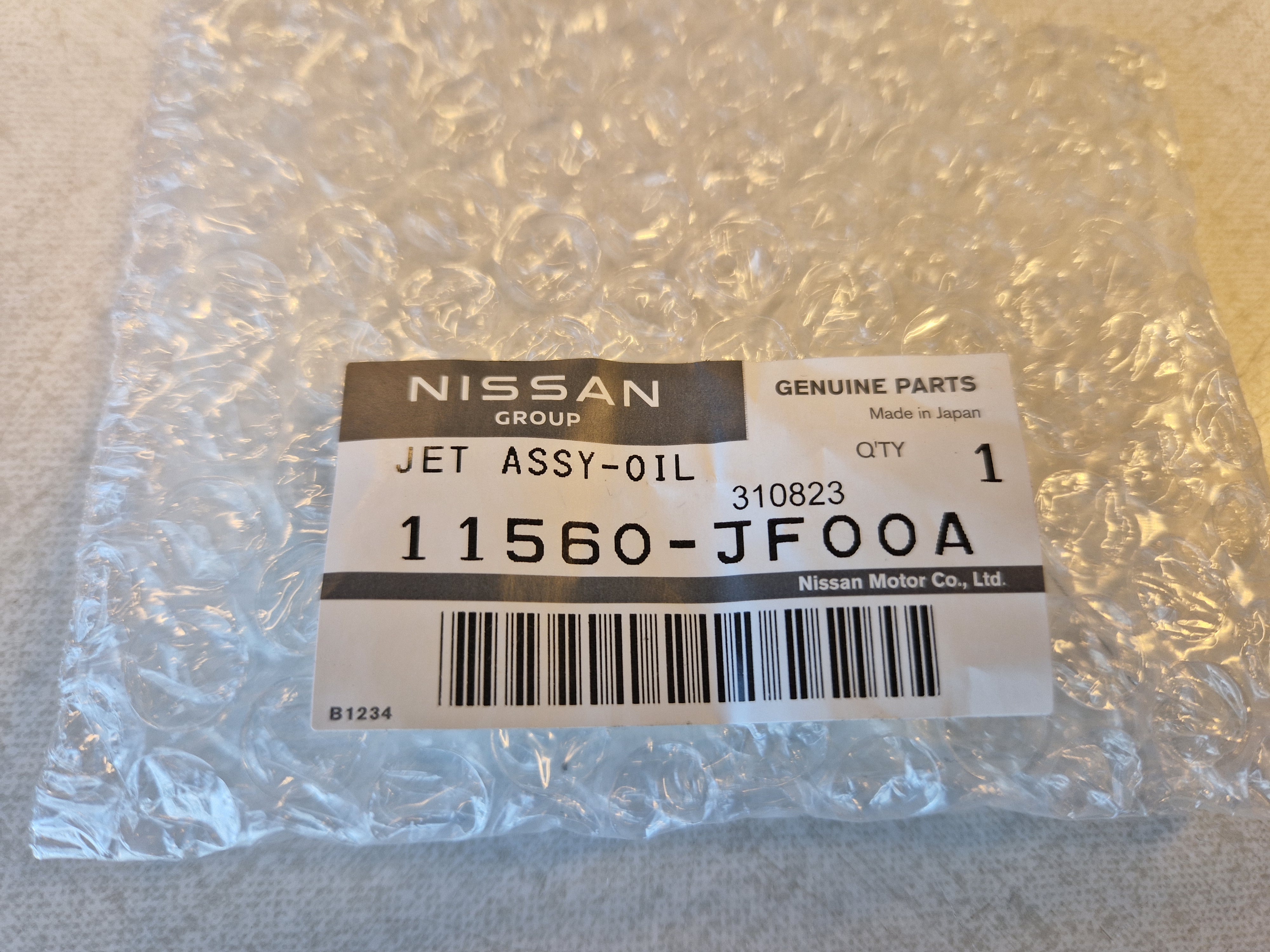 Nissan OEM VR38DETT oil jet + bolt 11560-JF00A - Klik om te sluiten
